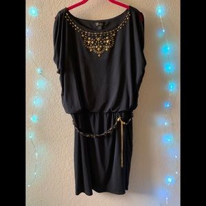 Thalia Sodi black dress with gold accent and belt